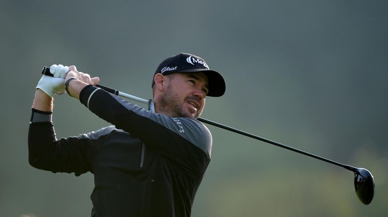 Brian Harman tees off on the second hole during the...