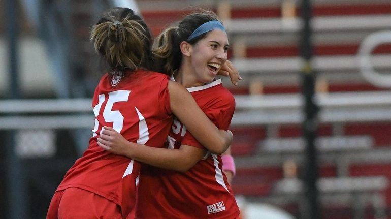 Mikayla Camp of Syosset (right) celebrates her goal during a...