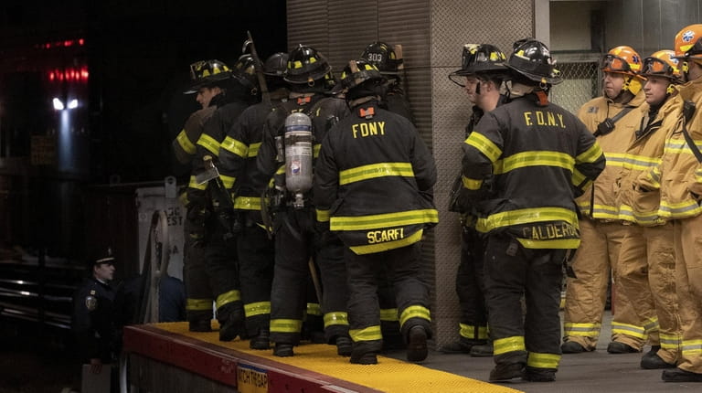 Firefighters respond to a train derailment at the Jamaica LIRR...