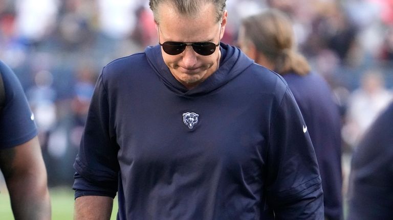 Chicago Bears head coach Matt Eberflus walks off the field...