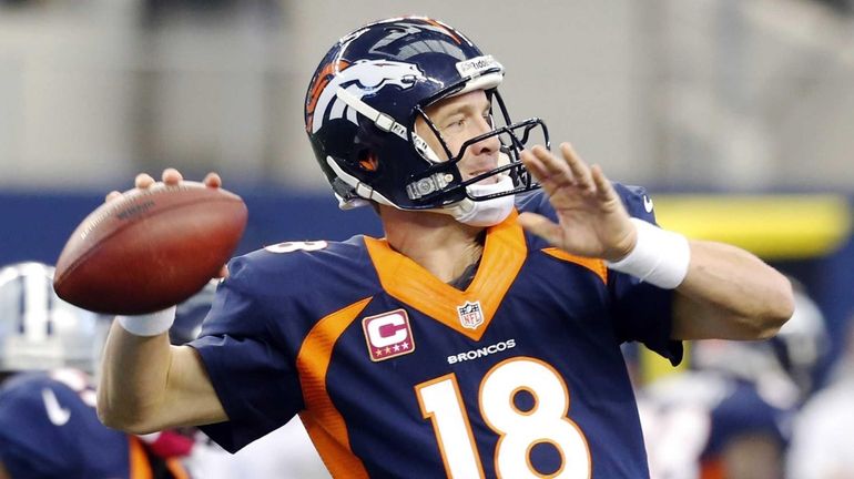 Denver Broncos quarterback Peyton Manning passes the ball against the...