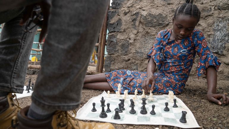 13 year-old Arusi Wegeneza plays a chess game at 'The...