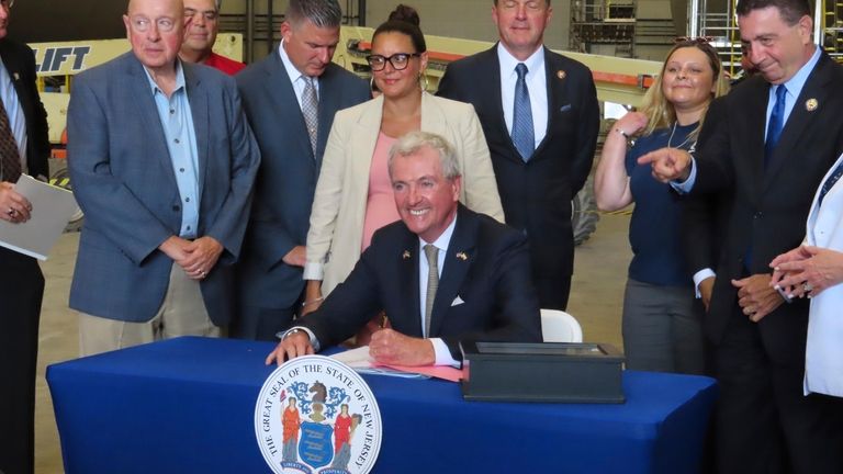 New Jersey Gov. Phil Murphy signs a bill in Paulsboro...