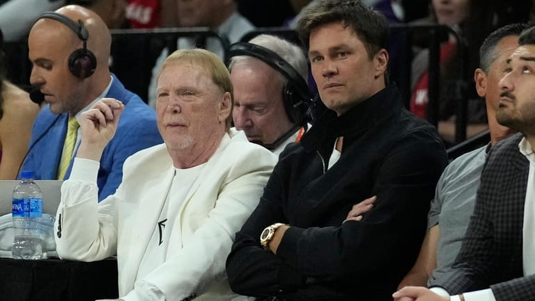 Mark Davis, left, owner of the Las Vegas Aces and...