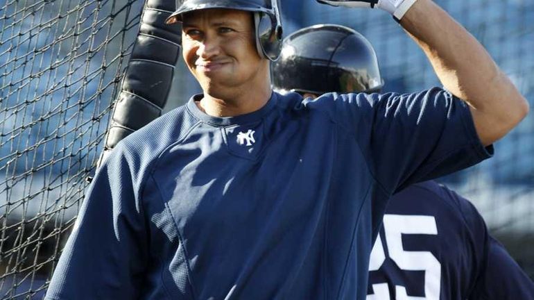 The New York Yankees' Alex Rodriguez takes fielding practice with