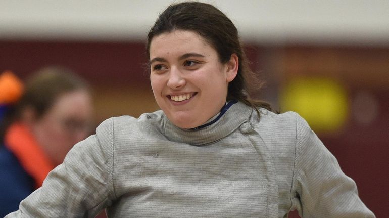 Dianna Nielsen of Ward Melville reacts after a saber victory...