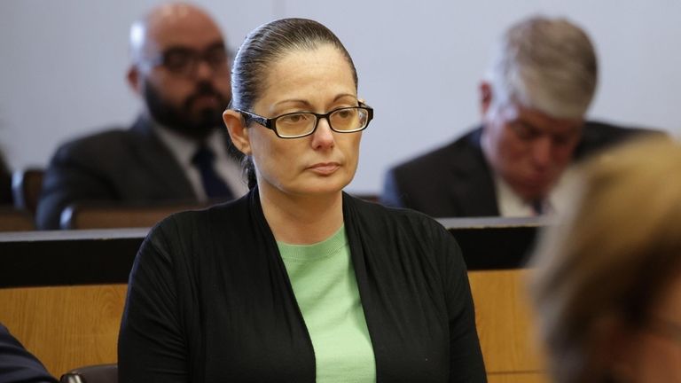 Angela Pollina listens to opening statements on Monday at her murder...