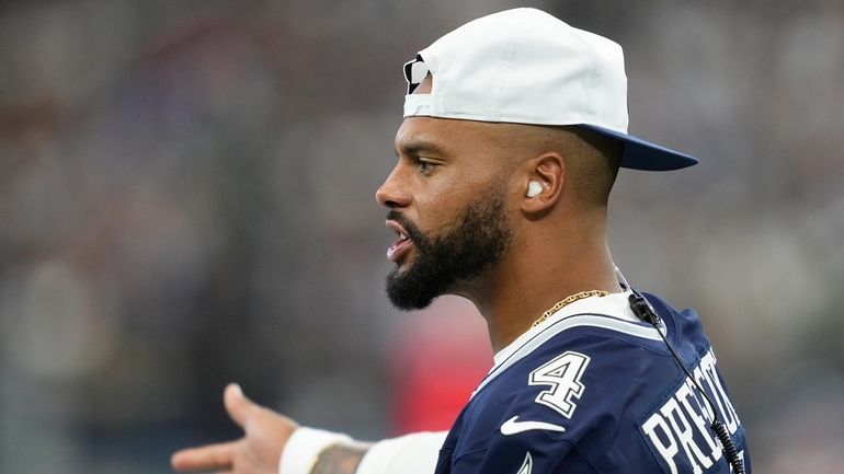 Dallas Cowboys quarterback Dak Prescott stands on the sideline during...