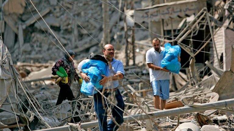 Lebanese residents of a Hezbollah stronghold in the southern suburbs...