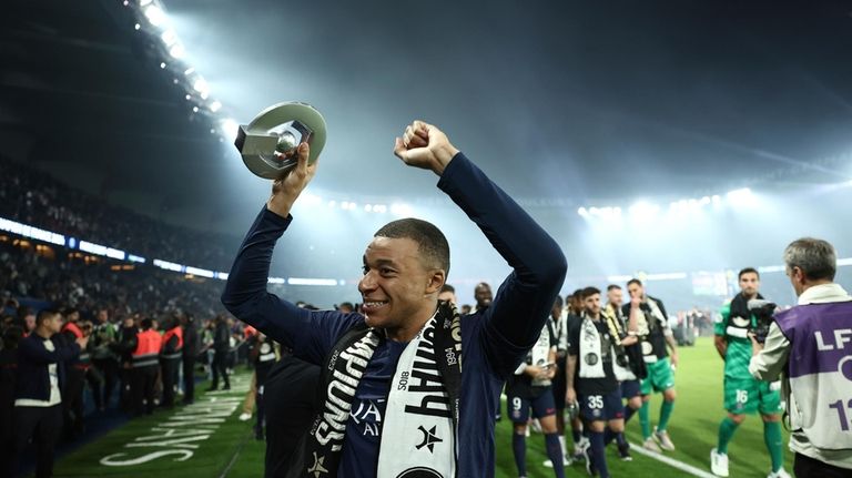 PSG's Kylian Mbappe celebrates PSG's French League One title after...