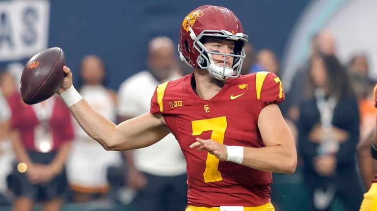 Southern California quarterback Miller Moss looks to pass during the...