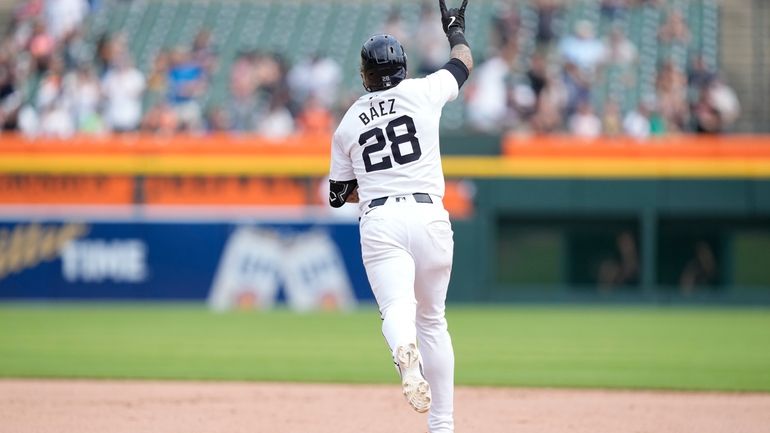 Detroit Tigers' Javier Báez rounds the bases after his two-run...