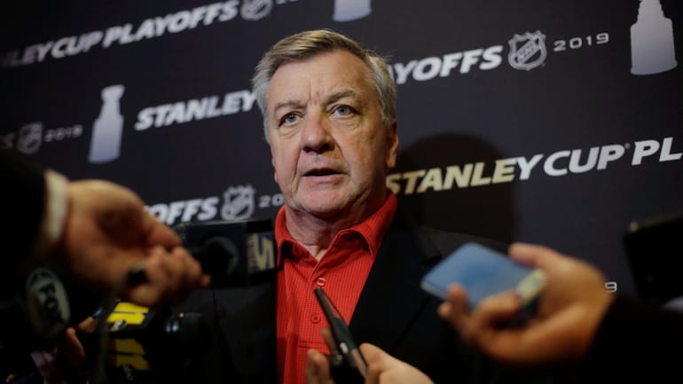 Carolina Hurricanes general manager Don Waddell faces reporters during a...