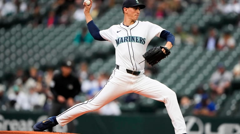 Seattle Mariners starting pitcher George Kirby throws against the Kansas...