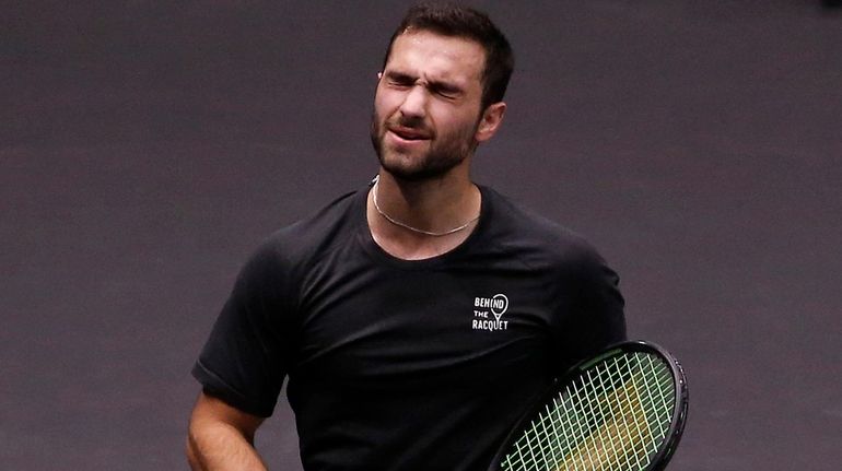 Noah Rubin reacts after a shot against Paolo Lorenzi during...