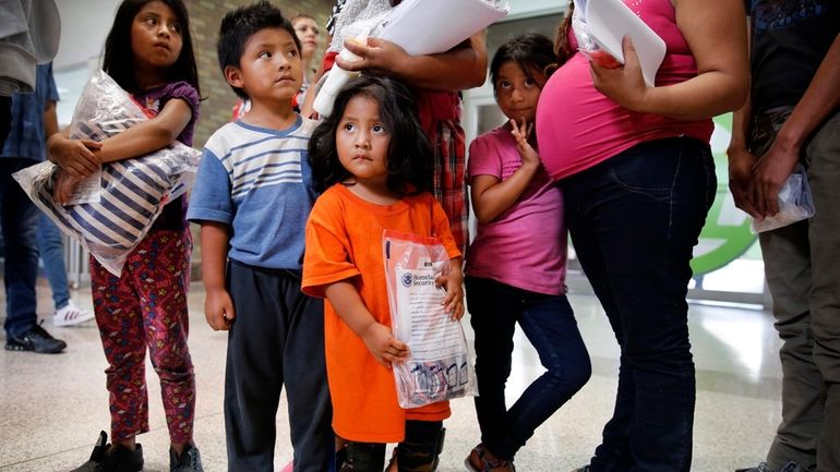 Ingrid Yanet Lopez Hernandez, 32, center back, her children, from...