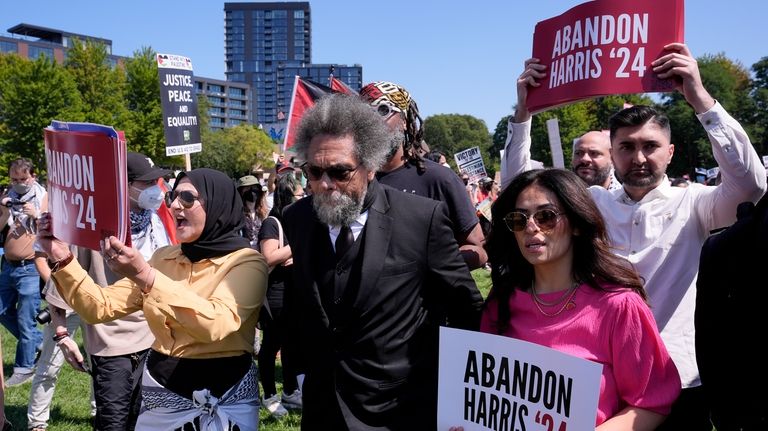 Progressive activist Cornel West watches a demonstration prior to in...