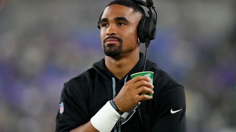 Philadelphia Eagles' Jalen Hurts watches from the sidelines during the...