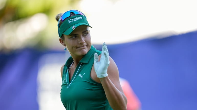 Lexi Thompson reacts after making birdie on the 12th hole...