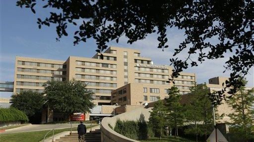 A man walks up the stairway leading to Texas Health...