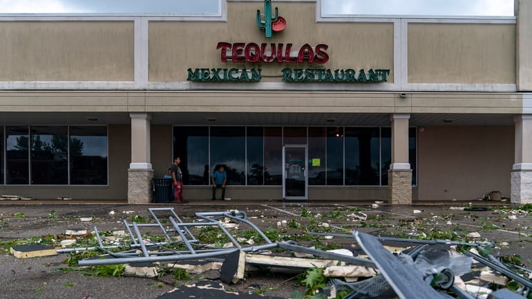 A cart return is mangled outside Tequilas Mexican Restaurant in...