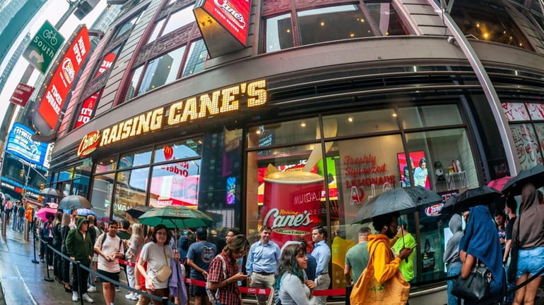 Crowds flock to the grand opening of Raising Cane's in Times...