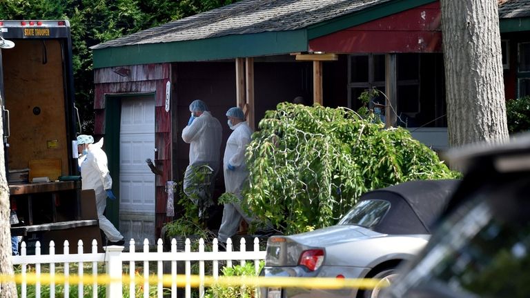 Crime scene police at the Massapequa Park home of Rex A....