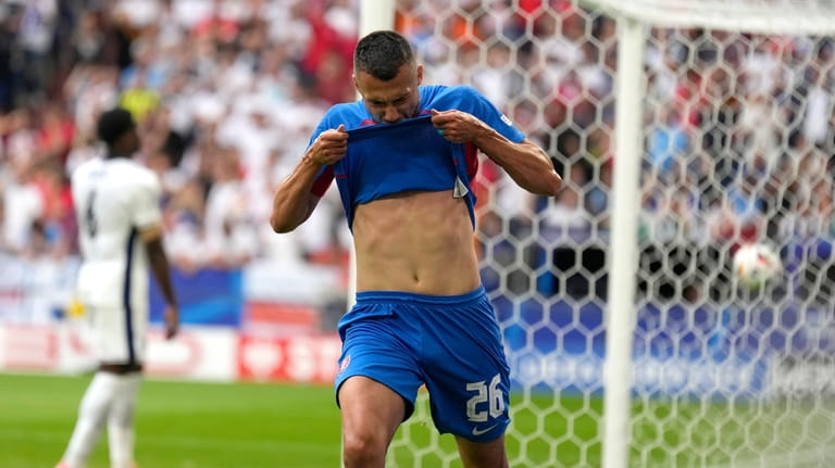 Slovakia's Ivan Schranz celebrates after scoring his side's opening goal...