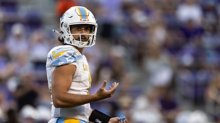 Long Island University quarterback Luca Stanzani (11) looks backs at...