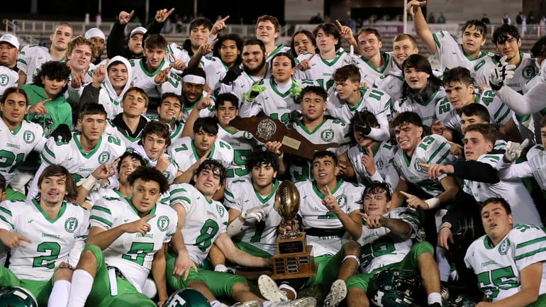 Farmingdale poses with the Class I Long Island Championship trophy...