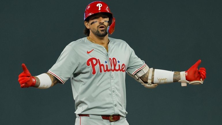 Philadelphia Phillies' Nick Castellanos celebrates his two-run double against the...