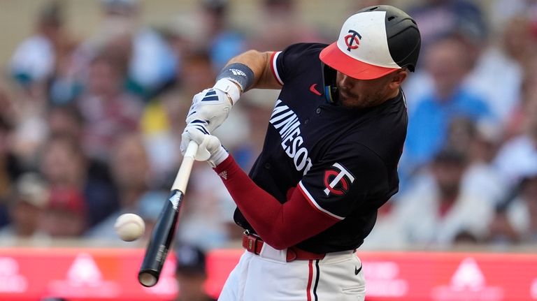 Minnesota Twins' Trevor Larnach hits a 3-run home run during...