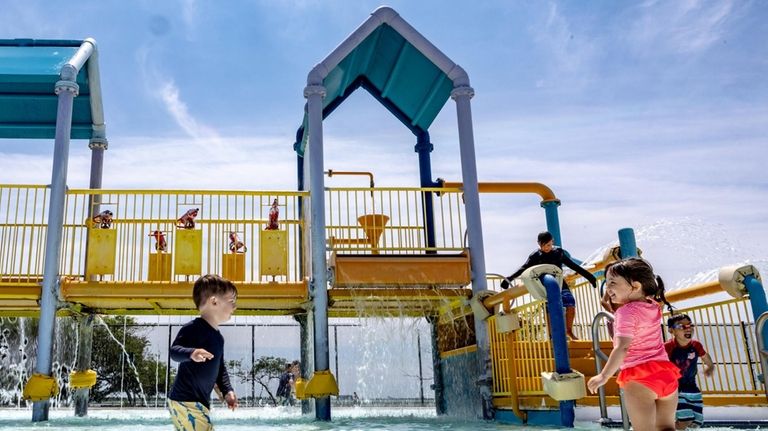 Michael Devivo and Luce Forgione enjoying the spray park at Wantagh...