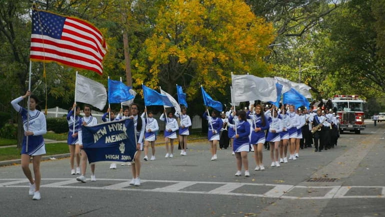 New Hyde Park Memorial High School's cheerleaders lead the annual...