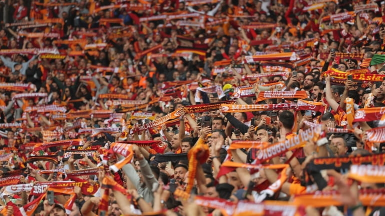Galatasaray fans cheer during a Turkish Super Lig soccer match...