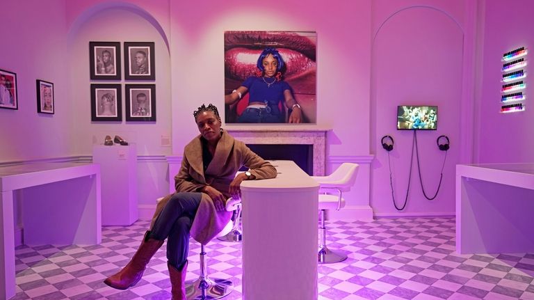 British photographer Eileen Perrier poses in front of her artwork...