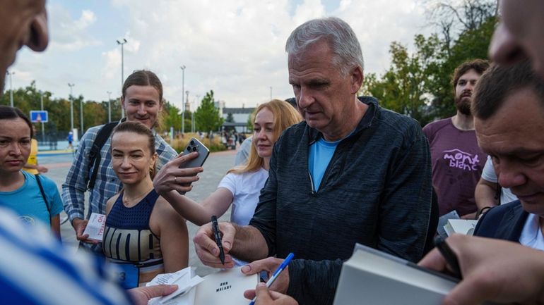 U.S. historian and author Timothy Snyder gives autographs on his...