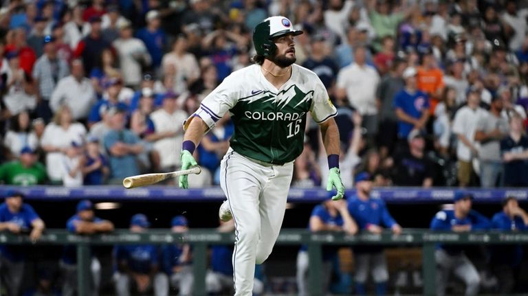 Colorado Rockies' Sam Hilliard drops his bat after hitting a...