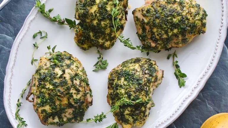 Chicken thighs coated with a fresh herb paste.
