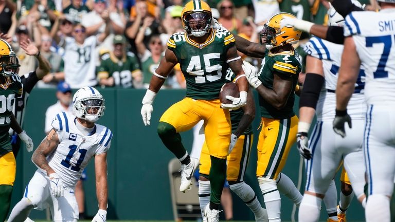 Green Bay Packers linebacker Eric Wilson (45) reacts after intercepting...