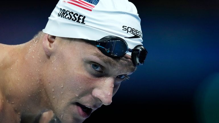 Caeleb Dressel of United States, warms up ahead of the...