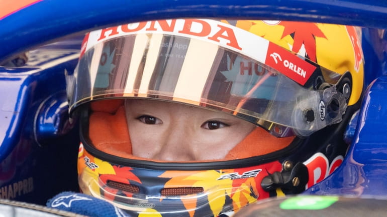 Team RB driver Yuki Tsunoda, of Japan, gets ready for...