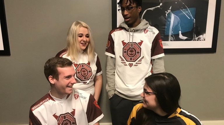 Bay Shore High School seniors (left to right) Ryan Champlin,...