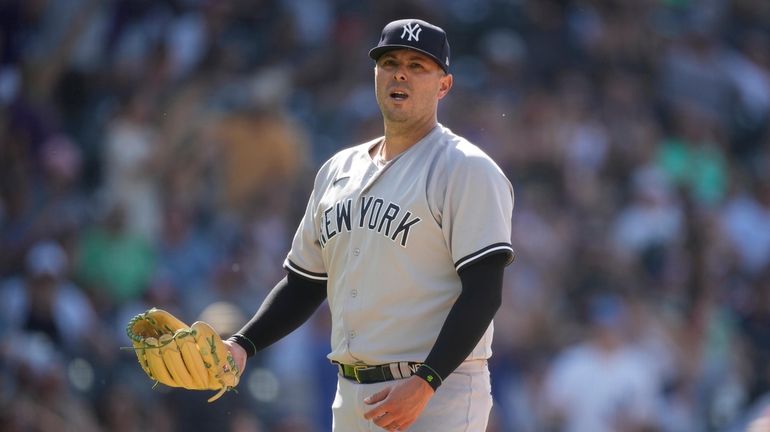 Yankees relief pitcher Nick Ramirez reacts after giving up a...