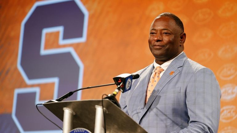 Syracuse head coach Dino Babers listens to a question at...