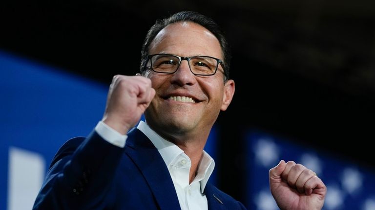 Pennsylvania Gov. Josh Shapiro gestures at a campaign event for...