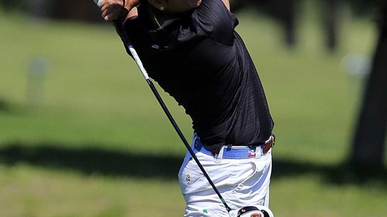 Garden City's Sam Sessa tees off on the seventh hole...