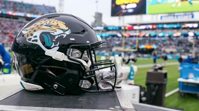 a Jacksonville Jaguars helmet sits on a box on the...