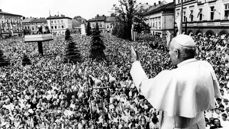 Pope John Paul II. waves to huge crowd of faithful...