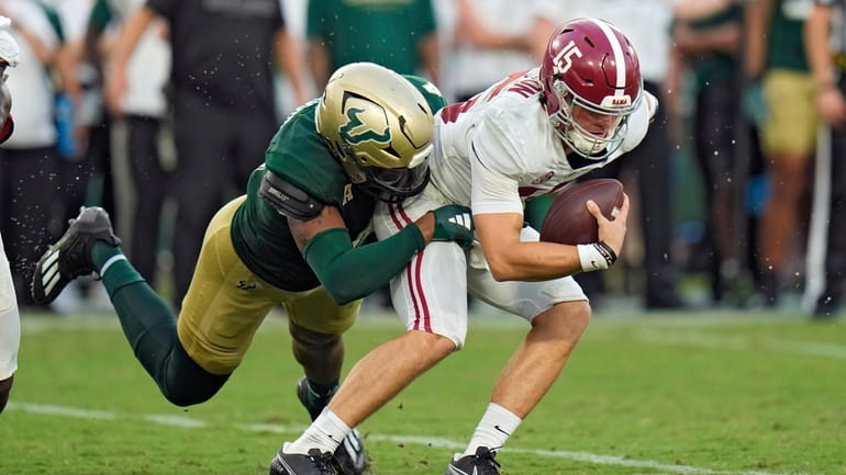 Alabama quarterback Ty Simpson (15) is sacked by South Florida...